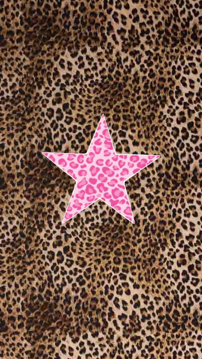 a pink star on top of a leopard print background