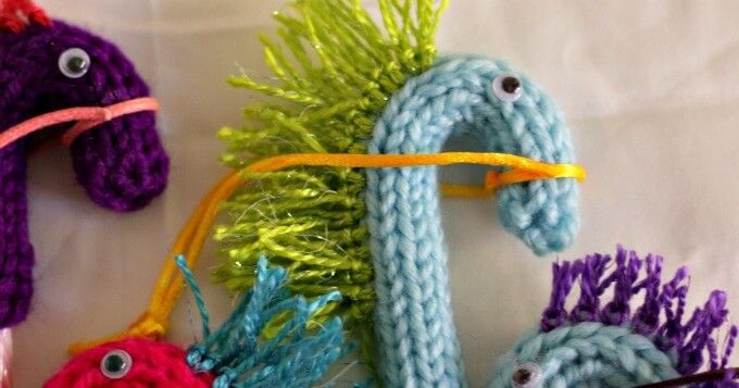 crocheted seahorses and fish made from yarn