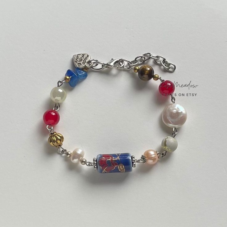 "A sweet handmade bracelet ✿ Made with freshwater pearls, crystal beads, metal accents, and tigers eye ✿ Pearlescent white and peach, red, azure blue, milky white, neutrals, gold, and silver ✿ The bracelet has an additional 1 - 1.5\" of extension chain. ✿ Some beads may be added or removed depending on the length selected" Bracelet Inspo Beads, Vintage Heart Jewelry, Beaded Bracelet Diy, Pulseras Kandi, Beads Bracelets, Jewelry Accessories Ideas, Dangle Necklaces, Funky Jewelry, Pretty Bracelets