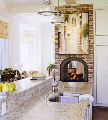 a kitchen with an oven, sink and counter tops in it's center island