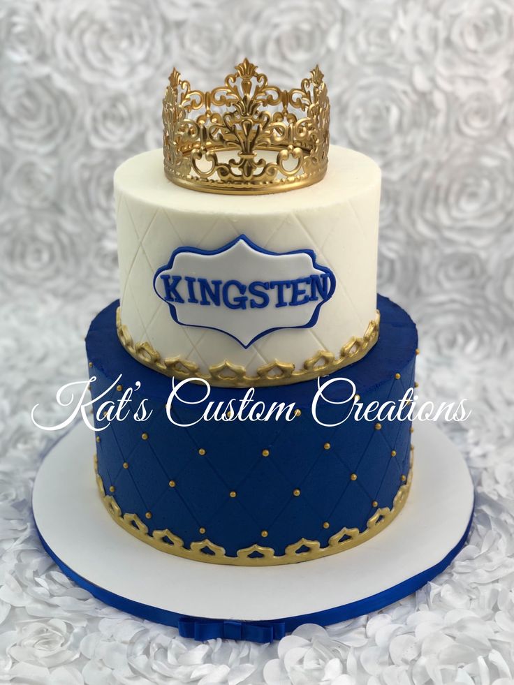 a three tiered cake with a crown on top