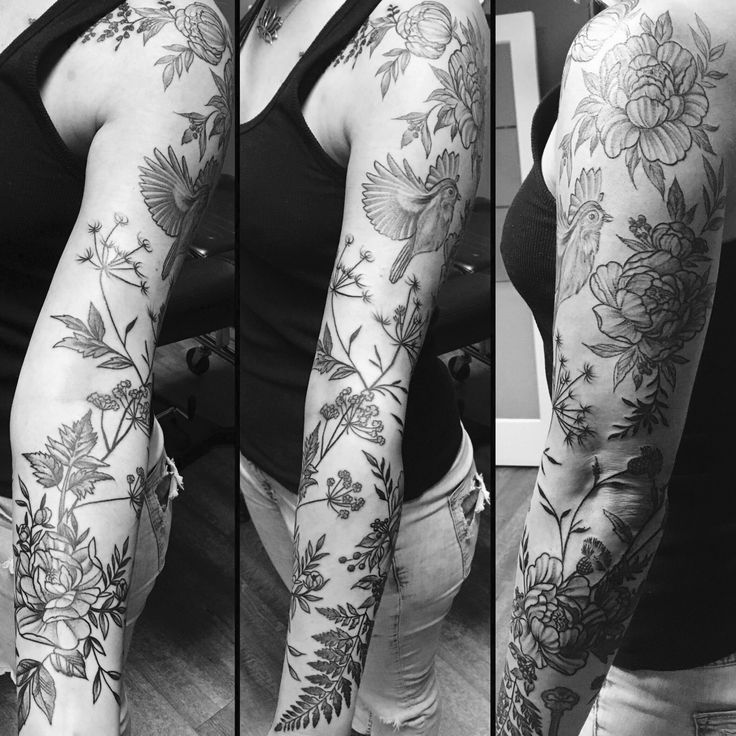 the woman has tattoos on her arms and arm, which are covered with flowers in black and white