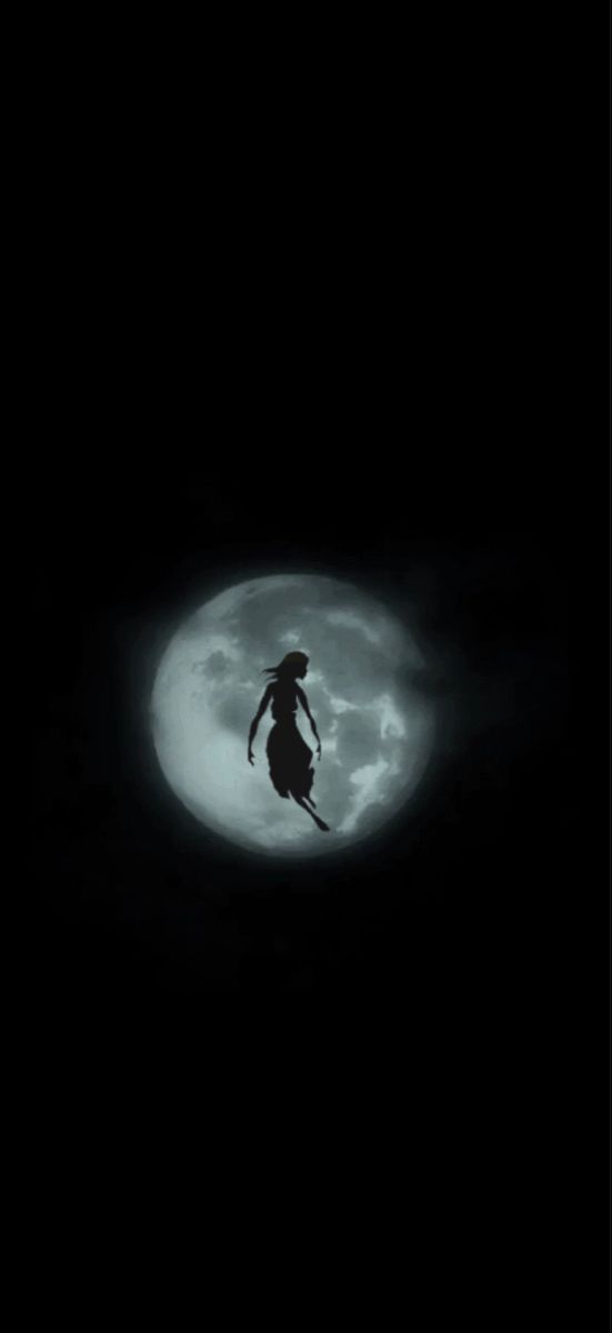 a person flying through the air in front of a full moon