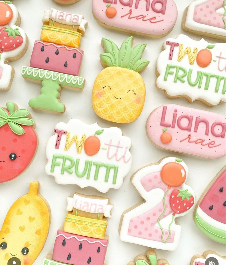 some decorated cookies are laying on a table