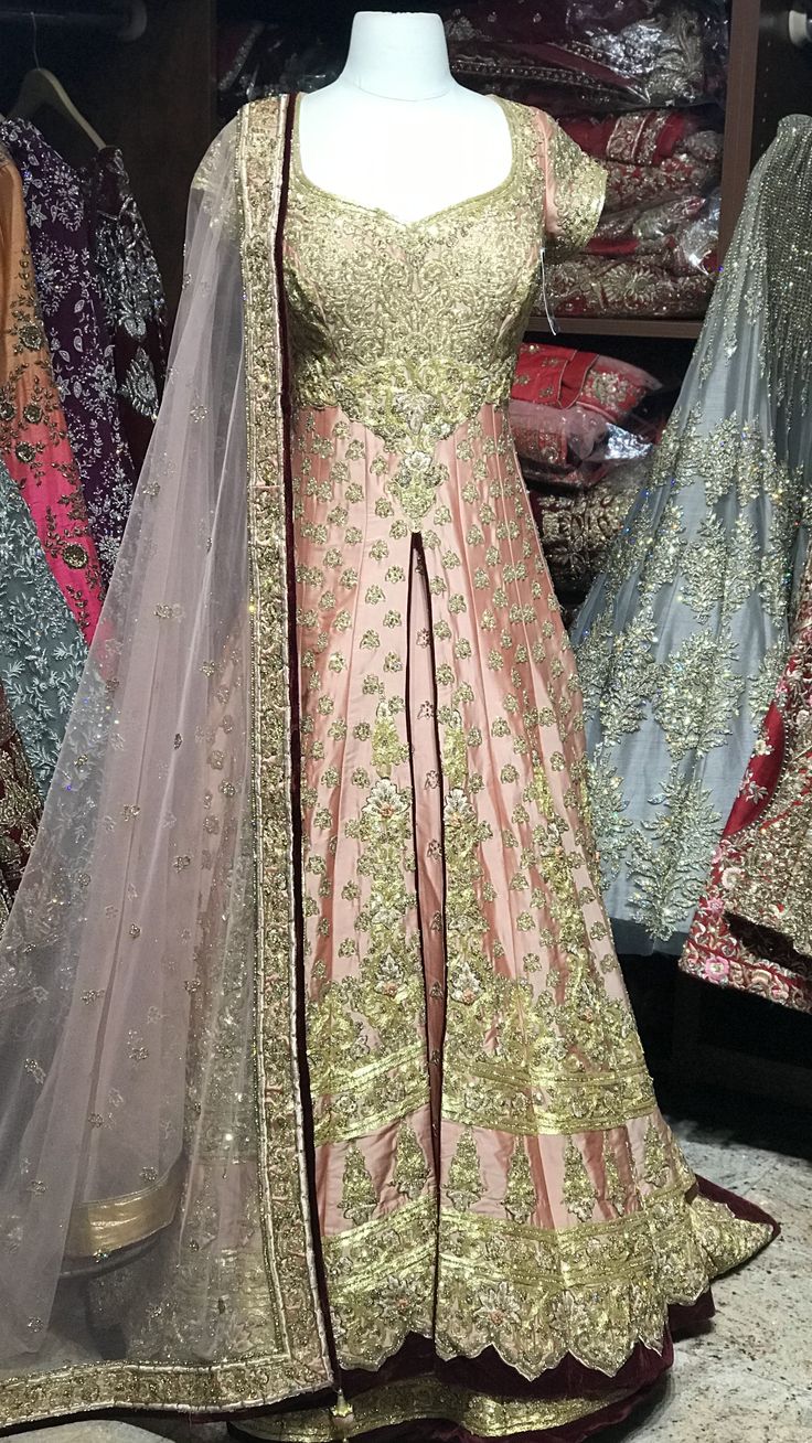 Soft peach silk lacha with heavy gold embroidery contrasted with maroon velvet borders! The jacket has a sweetheart neck, cap sleeves and a beautiful train! Paired with a Lehenga and dupatta! Size 38 Ready to Ship! Kanwal Aftab, Gowns Dresses Indian, Dior Atelier, Latest Bridal Dresses, Pakistani Dresses Casual, Jewellery Indian, Simple Pakistani Dresses, Dresses Indian, Bridal Dress Design