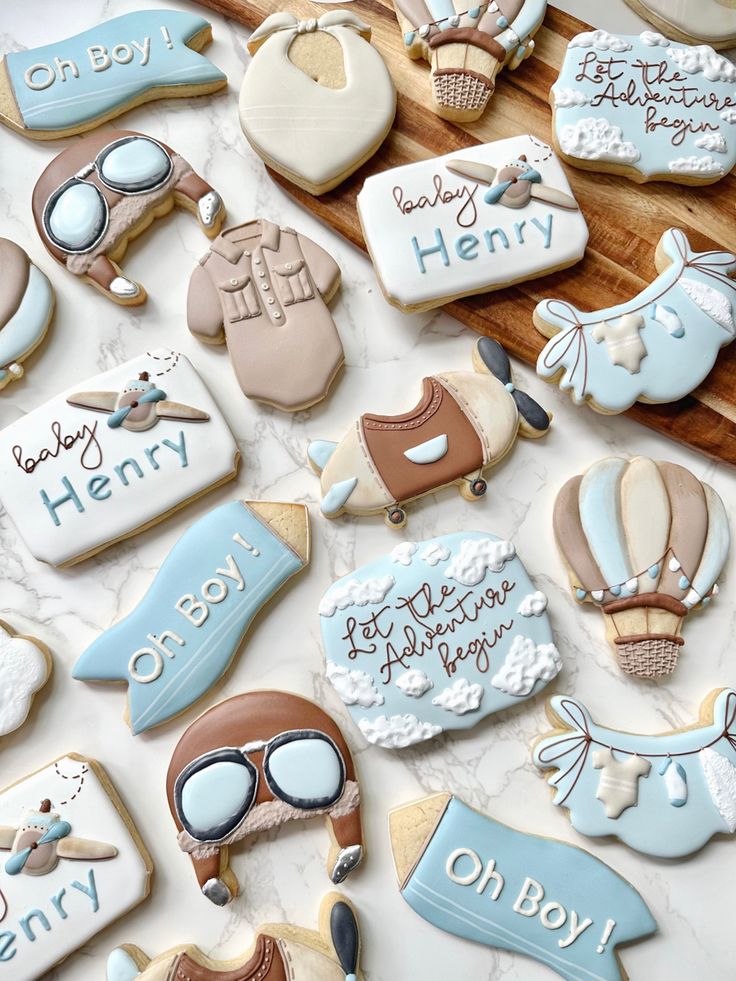 many decorated cookies are displayed on a table