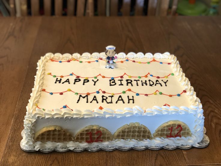 a birthday cake with the words happy birthday mariah on it and a small figure