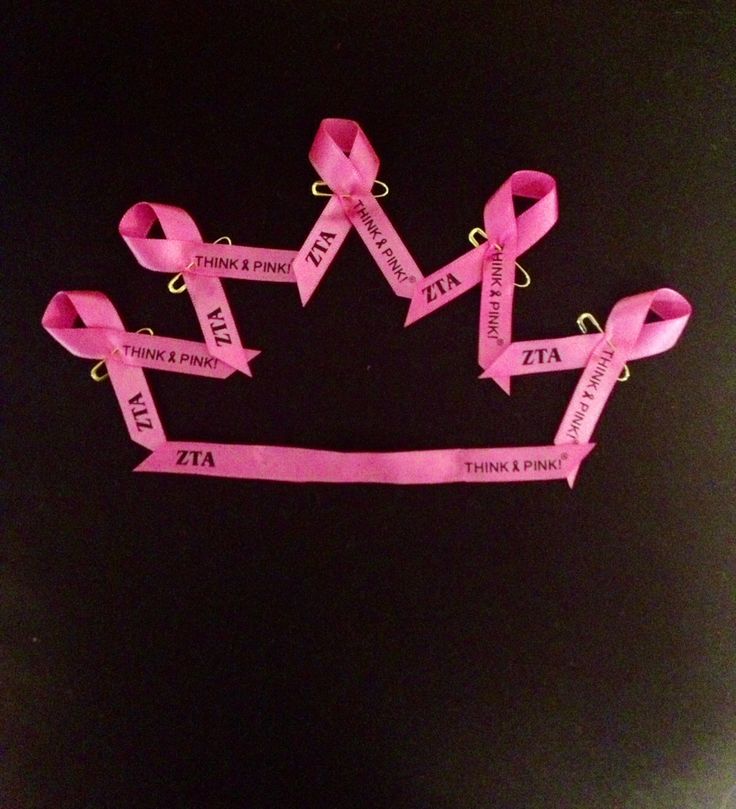 there are pink ribbons that have been tied to each other in the shape of a crown