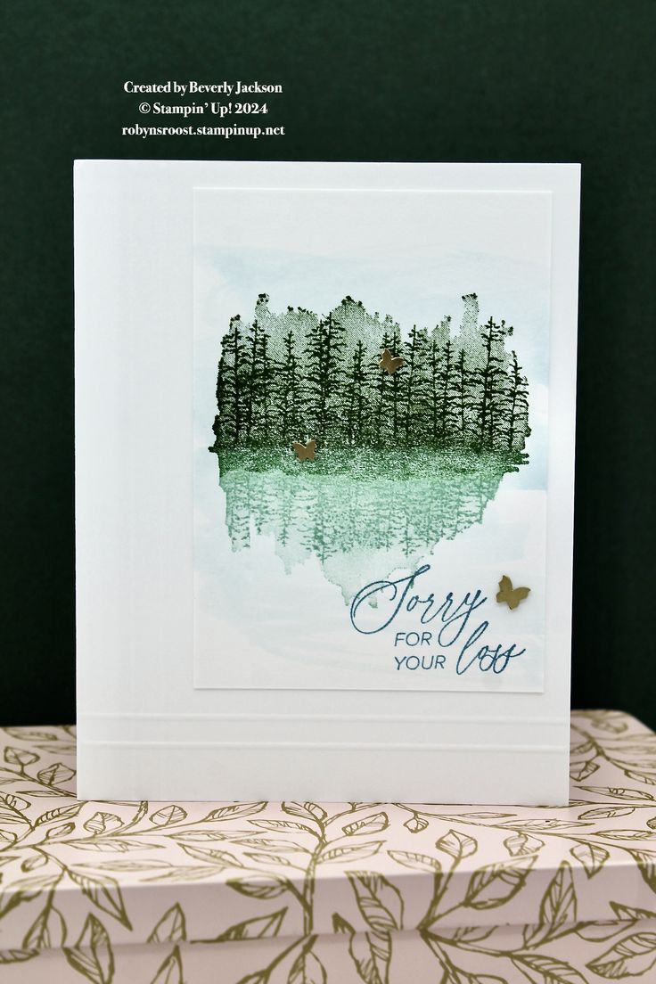 a card with watercolor trees and the words happy for you on it, sitting on top of a table