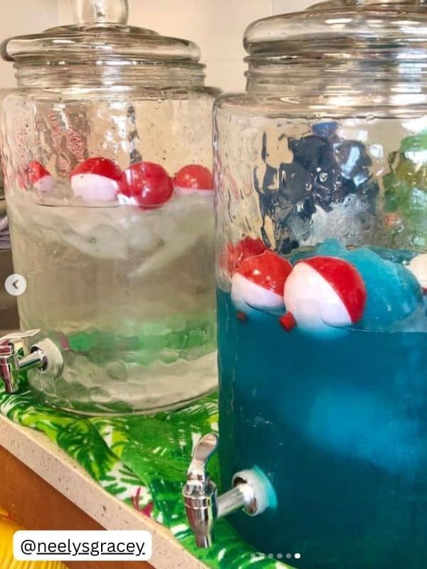 two glass jars filled with water and red and white balls on top of each other