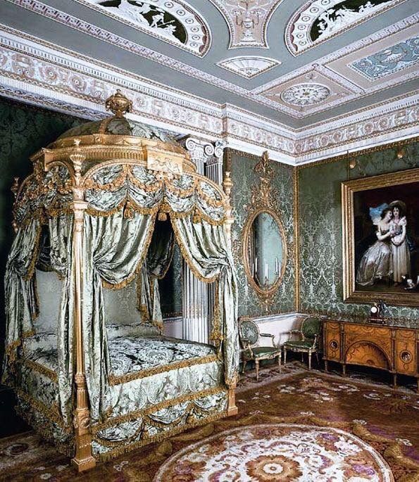 an ornately decorated bedroom with green walls