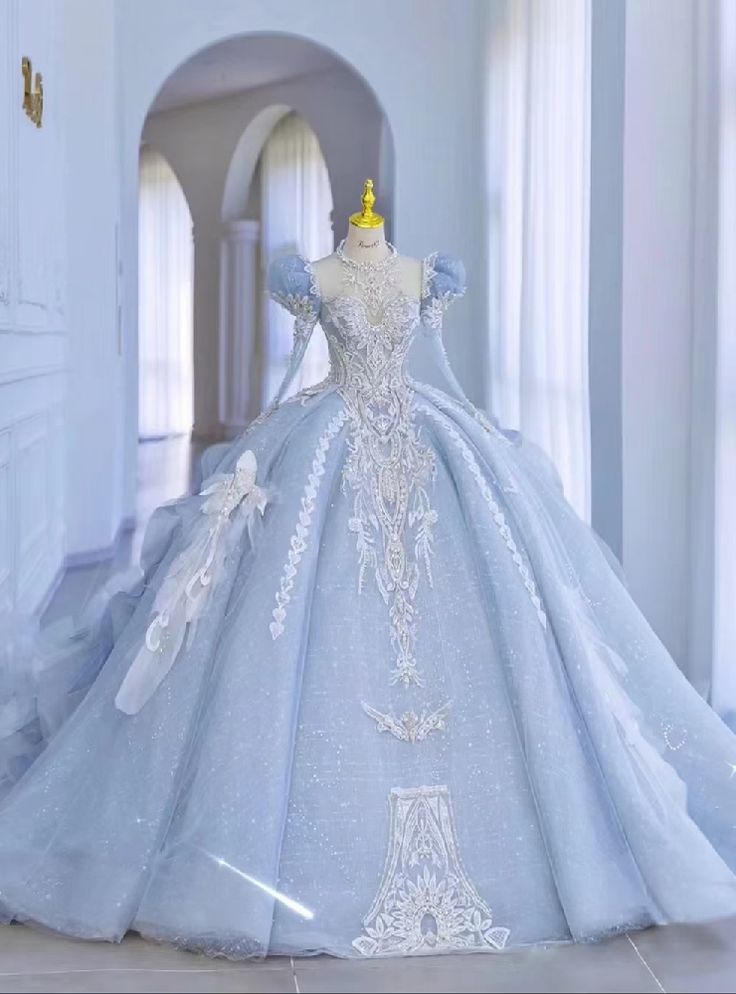 Flower with charm along with the flower made needleworks of this gown. Long Sleeve Backless Wedding Dress, Sleeve Backless Wedding Dress, Long Sleeve Wedding Dress Backless, डिजाइनर कपड़े, Blue Ball Gown, Blue Ball Gowns, Pretty Quinceanera Dresses, 파티 드레스, Blue Ball