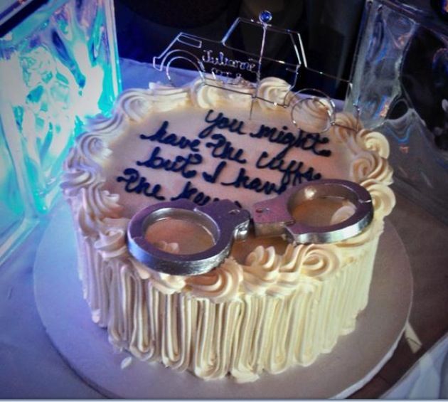 a birthday cake with two handcuffs on it and the words you might never have to cut this cake