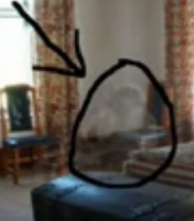 a blurry image of a living room with furniture