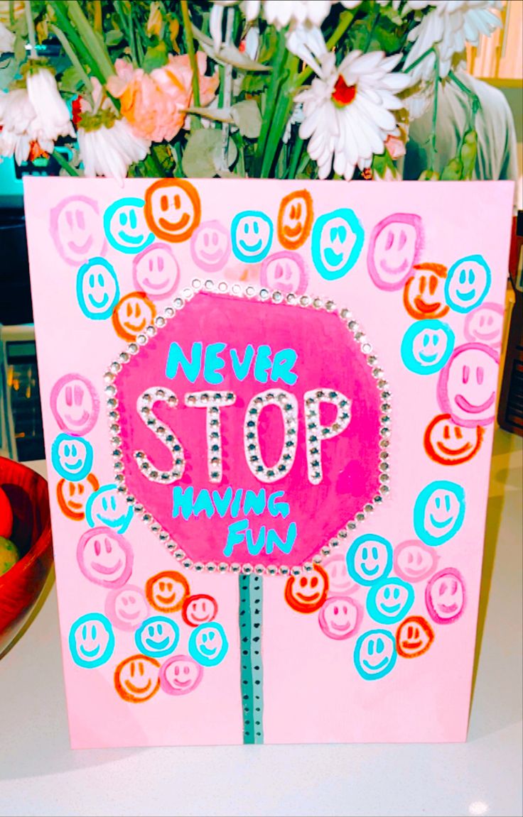 there is a pink card with a stop sign on it