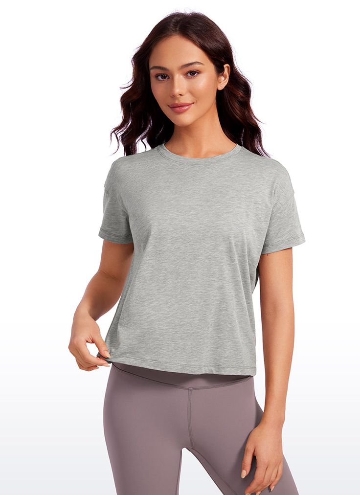 Pima Cotton collection is super soft and feels great against your skin, aiming to offer a comfortable feeling to you. Athletic short sleeve crop tops designed with a round neckline and flowy style for a simple and stylish look. Loose fit design allows you to move freely without restriction during exercise. Ideal for yoga, workout, and casual wear. Feature & Fitting: 
 Pima Cotton collection 
 Design for low-impact workouts or daily wear 
 Relaxed fit for moving freely 
 Round neck, hip lengt Casual Cropped T-shirt For Workout, Relaxed Fit Cropped T-shirt For Workout, Gray Relaxed Fit Short Sleeve Activewear, Basic Cropped Short Sleeve T-shirt For Workout, Basic Cropped T-shirt For Workout, Solid Cropped Crew Neck T-shirt For Workout, Short Sleeve Cropped T-shirt For Workout, Solid Color Cropped T-shirt For Workout, Basic Short Sleeve Crop Top For Workout