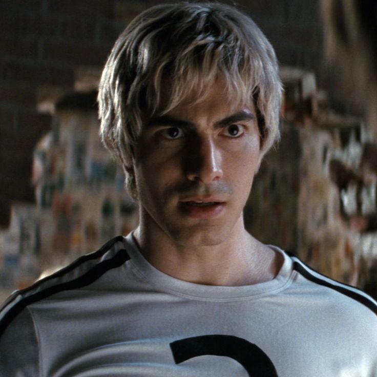 a man with blonde hair wearing a number five t - shirt in the movie scream zone