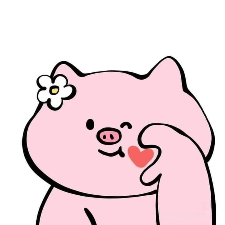 a pink bear with a flower on its head