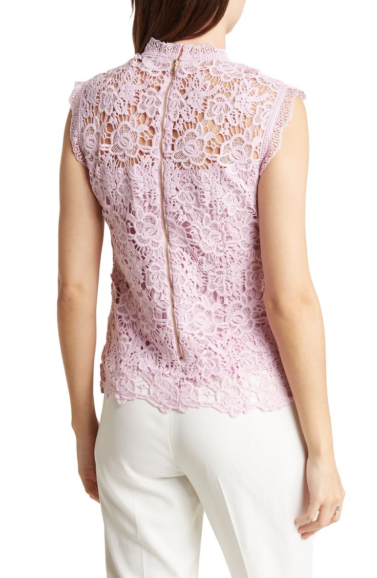 Intricate lace adds a touch of elegance to a mock-neck top with a tonal lining for sweet styling. 23" length (size Small) Mock neck Sleeveless Lined 100% polyester Hand wash, dry flat Imported Feminine Sleeveless Delicate Lace Top, Feminine Sleeveless Scalloped Lace Top, Feminine Scalloped Lace Sleeveless Top, Sleeveless Scalloped Lace Top, Fitted Scalloped Lace Sleeveless Top, Elegant Sleeveless Lace Top, Feminine Sleeveless Crochet Lace Top, Elegant Sleeveless Scalloped Lace Top, Spring Sleeveless Scallop Lace Top