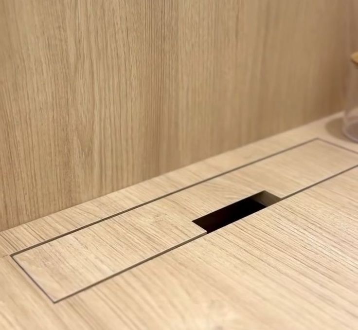 a wooden counter top with a hole in the middle