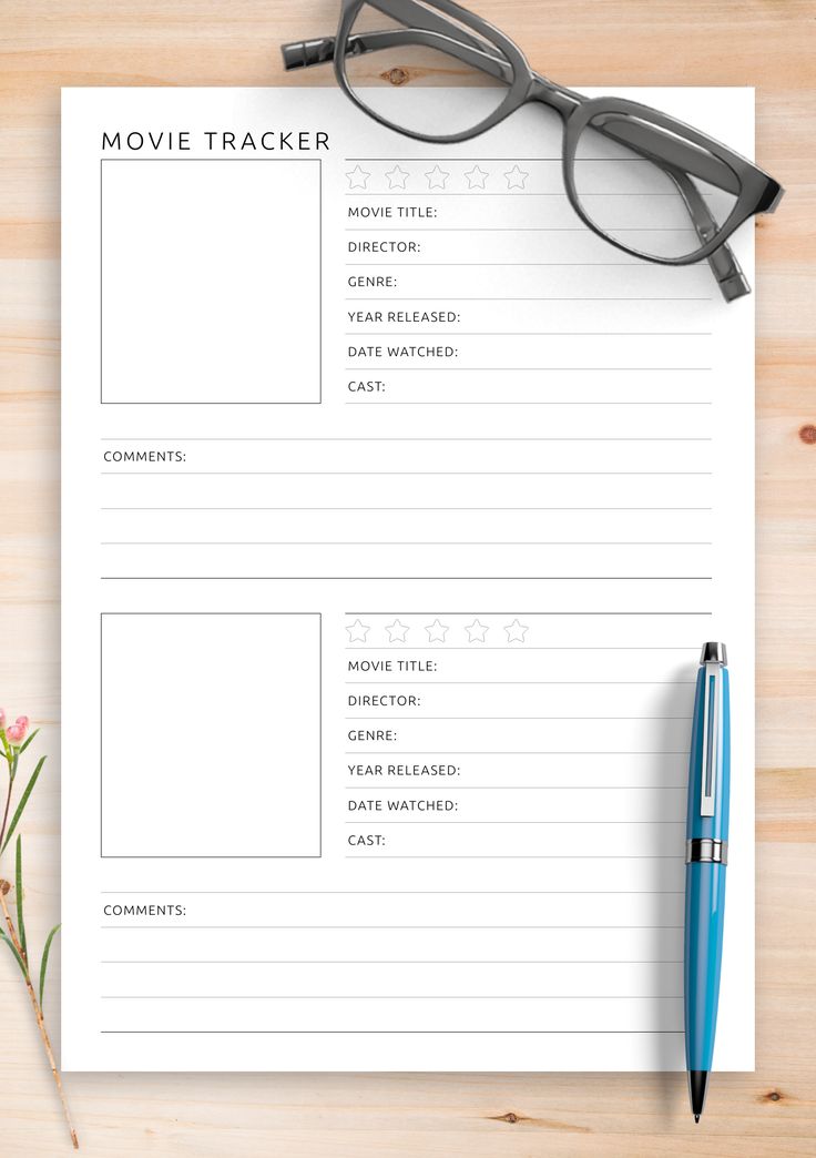 a movie tracker with glasses on top of it next to a pen and eyeglasses