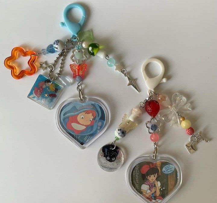 several key chains with various charms attached to them