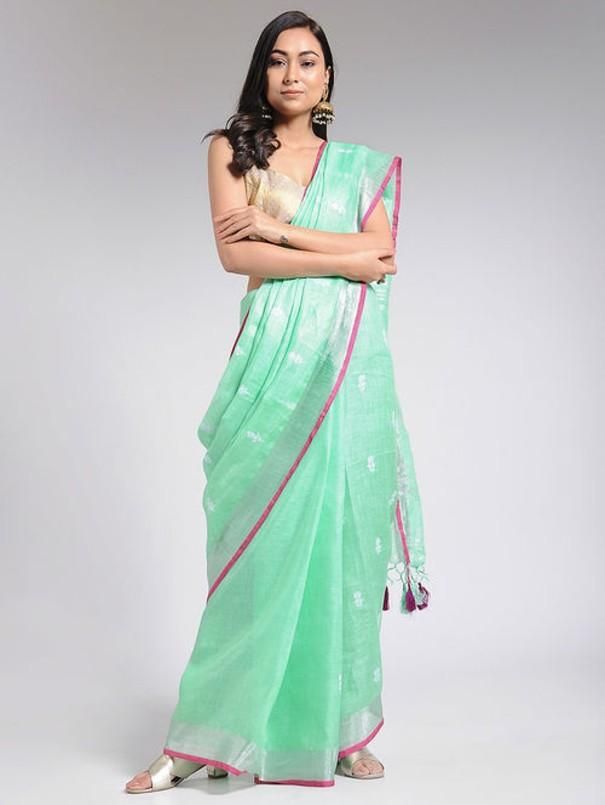 An embroidered linen saree with an all-over embroidered butti and zari details. Comes with a contrast blouse piece. Linen fabric Dry clean only Handcrafted in India Saree length - 5.5 meters Blouse: Length - 1 meter Model height 5 feet 7 inches Instructions: Dry clean only This product will be shipped within 20-25 days of the order placed Pink Linen Saree, Neem Tree, Trendy Suits, Linen Sarees, Linen Saree, Contrast Blouse, Anarkali Dress, Pink Linen, Indian Ethnic Wear