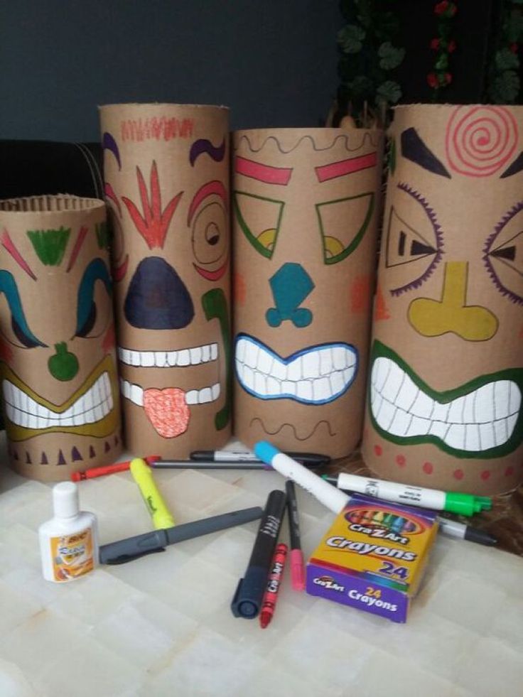 some crafting supplies are sitting out on a table with their faces painted onto them