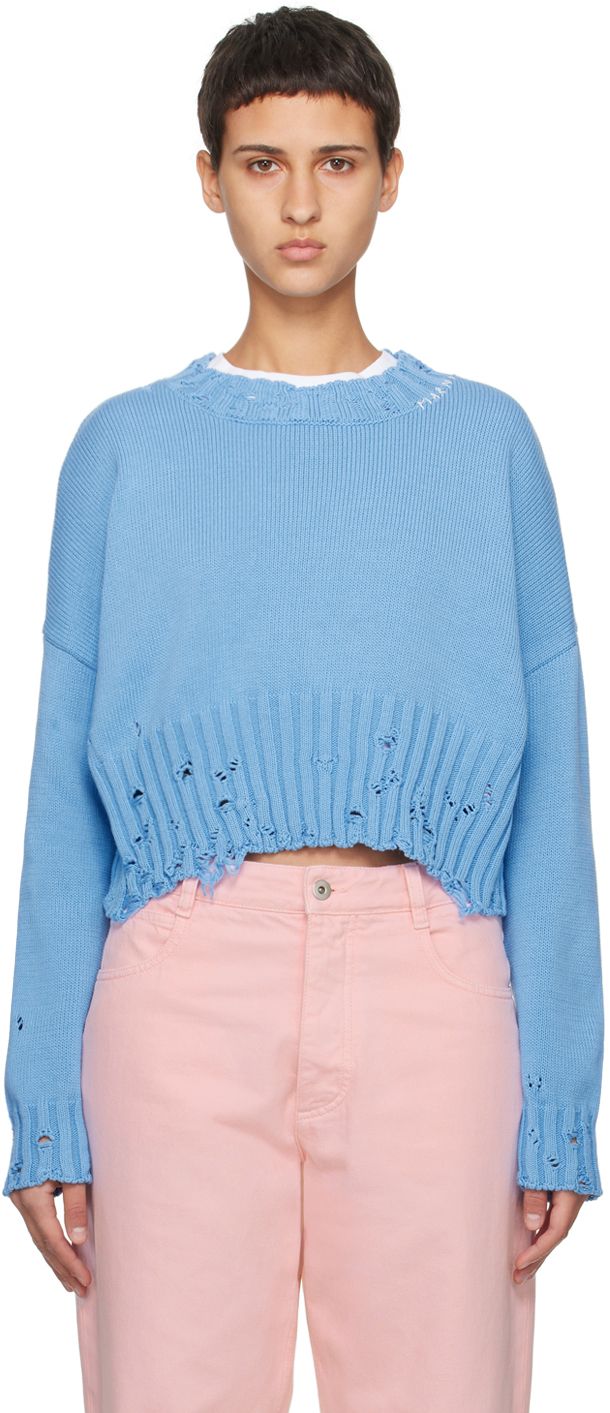 Knit cotton sweater. Distressing throughout. · Rib knit crewneck, cropped hem, and cuffs · Hand-stitched logo at collar · Dropped shoulders Supplier color: Iris blue Cotton Cropped Crew Neck Sweater, Cotton Crew Neck Cropped Sweater, Blue Cotton Cropped Sweater, Blue Cropped Sweater Crew Neck For Spring, Blue Cropped Crew Neck Sweater For Spring, Blue Cotton Cropped Sweater For Winter, Knit Crewneck, Knit Cotton, Cotton Sweater