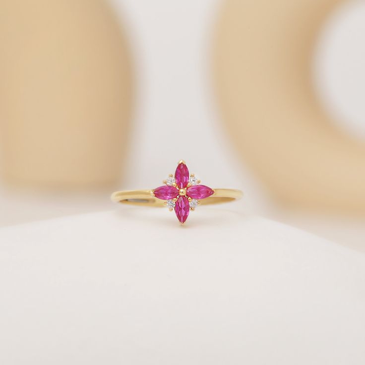 Your Ruby Engagement Ring is stylish, dainty and pretty ideal for everyday use. Details of solid gold handmade Flower Shape Ruby Ring are very eye-catching. It is a great gift for your loved ones. This jewelry will be an indispensable piece of yours. This meaningful Dainty Ruby Ring with high quality handwork will be a legacy you can leave to your family its.  * Vintage Style Ruby Ring Details * Material / Gold Kt:  14K (585), 18K (750), 8K (333) * Available Gold Colors: Yellow Gold, White Gold, Gold Marquise Ruby Ring For Gift, Dainty Gemstone Cluster Ring As Gift, Dainty Gemstone Cluster Ring For Gift, Dainty Marquise Ring For Gift, Gift 14k Gold Flower Ring With Gemstones, 14k Gold Flower Cluster Ring Gift, 14k Gold Flower Ring With Gemstone For Gift, Yellow Gold Flower Ring Gemstone Gift, 14k Gold Flower Ring With Gemstones As A Gift