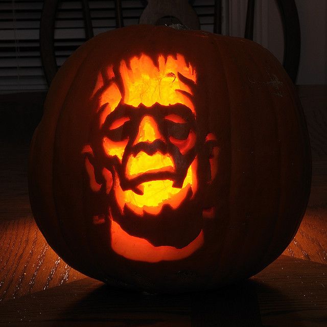 a pumpkin carved to look like abraham lincoln