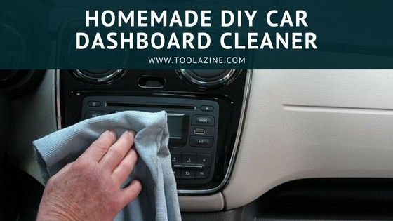 a person wiping up the dashboard of a car