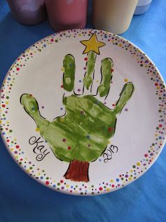 a paper plate with a hand painted on it