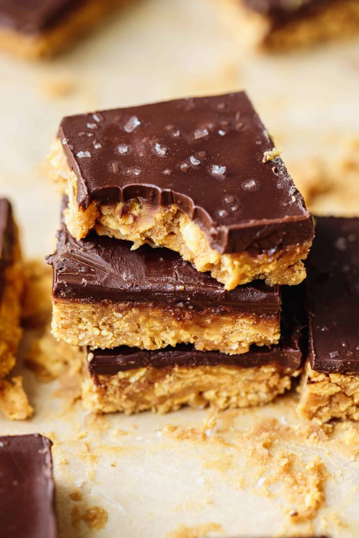 chocolate and peanut butter bars stacked on top of each other