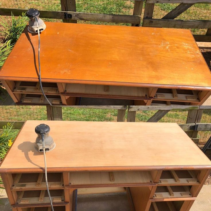 an old wooden desk is being worked on