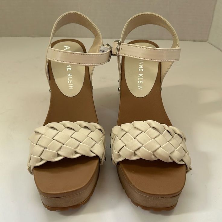 Anne Klein White Lori's Woven Ankle Strap Cream Wedge Sandals With Heel Strap And Round Toe, Casual Ankle Strap Heels With Woven Sole, Casual Cream Heels Medium Width, Casual Cream Medium Width Heels, Cream Block Heel Casual Wedge Sandals, Casual Cream Wedge Sandals With Block Heel, Cream Leather Heels With Woven Sole, Casual Cream Block Heel Wedge Sandals, Casual Cream Heels With Reinforced Heel