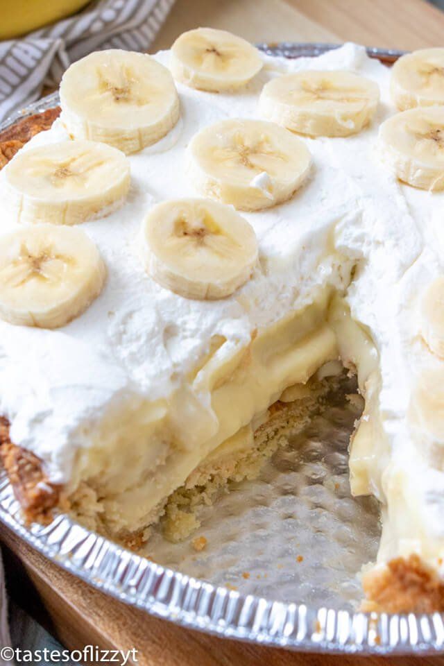 a banana cream pie is cut into slices