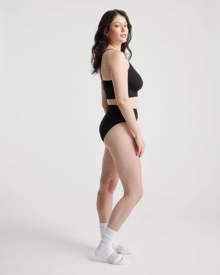 With a barely-there feel, this seamless style smooths and flatters to ensure you're comfortable throughout the day. It is the perfect foundation for any outfit.  | Quince | Women's Comfort Rib T-Back Bralette in Black, Size Small/Medium, Nylon/Spandex Fitted Smoothing Sports Bra, Smoothing Fitted Sports Bra, Seamless Minimal Stretch No-show Bra, Solid Color No-show Bra With Minimal Stretch, Seamless Second-skin Sleek Shapewear, Sleek Seamless Second-skin Shapewear, Sleek Second-skin Seamless Shapewear, Sleek Smoothing Shapewear With Minimal Stretch, Modern Seamless Stretch Sports Bra