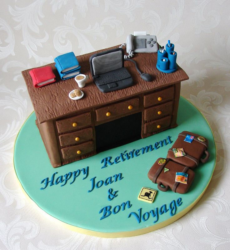 a cake that is shaped to look like a desk with luggage on it and the words happy retirement joan & bon voyage