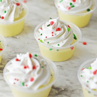 small cupcakes with white frosting and sprinkles