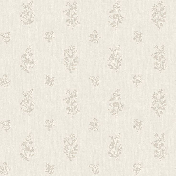 a white wallpaper with small flowers on it