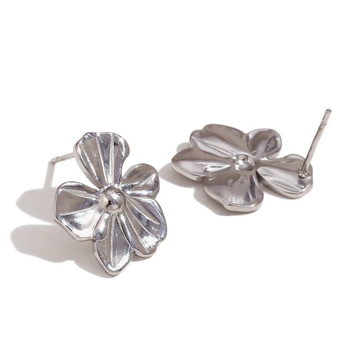 Add a pop of fun to your spring wardrobe with these Flower Statement Earrings! These large flower earrings are the perfect accessory to make a statement with your outfit. Embrace the spirit of the season with these playful and quirky earrings. DETAILS & SIZE Sold as a pair Finish: 18K gold plate Material: Stainless Steel Measurements: Large: 29mmx33mm; Medium: 19mmx16mmmm Weight: Large: 10.8 grams; Medium: 3.5 grams Comes with friction earring backs Waterproof, tarnish-resistant, and nickel free Shop Earrings to curate your ear stack! Whimsical Flower Earrings, Trendy Flower Charm Earrings For Spring, Trendy Silver Flower Earrings For Pierced Ears, Trendy Silver Flower Earrings, Whimsical Spring Earrings For Pierced Ears, Whimsical Flower-shaped Earrings For Party, Whimsical Spring Earrings, Silver Flower Shaped Earrings For Spring, Silver Flower Earrings For Spring