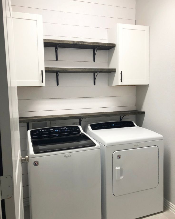 a white washer and dryer in a small room