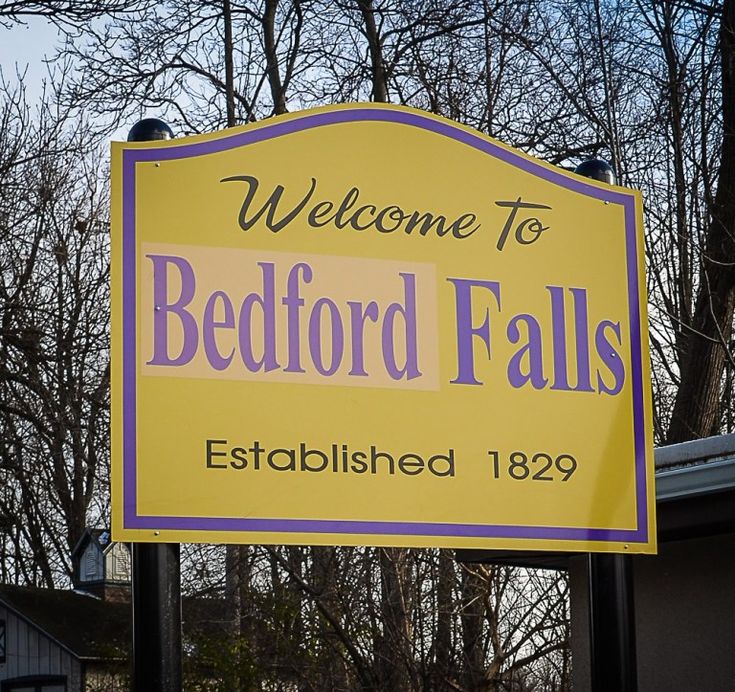 a welcome sign for bedford falls, established 1932