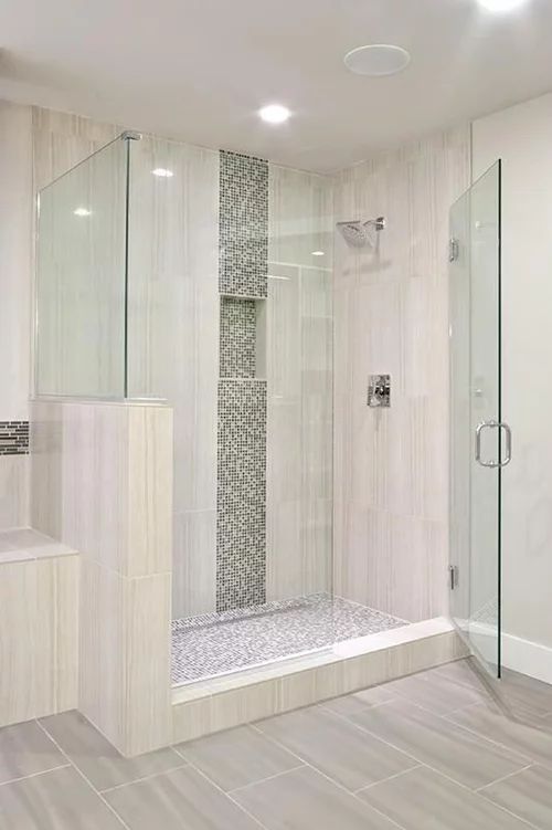 a bathroom with a walk in shower next to a sink