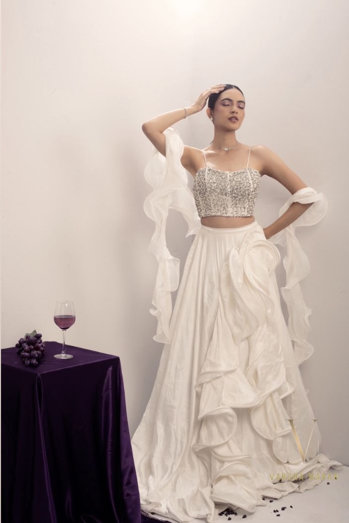 Pairing a heavy embellished White Top with a Jaw-Dropping Sculptured Skirt and a Two-Layered Ruffle Shawl. #varshamaranofficial #trending #fashion #bridal #style #instagram #instagood #clothing #amethyst #model #actor #fashiondesigner #varshamaran #embroidery #embellishment #purple #purpleelegance #abstractart #fashionmagazine #vogue #brand #newbeginnings #music #artist #reels #photography #photooftheday #photoshoot #makeup #shoot Shall Outfits, Ruffled Shawl, Artist Reels, Casual Hairstyles For Long Hair, Makeup Shoot, White Shawl, Photoshoot Makeup, Era Fashion, Casual Hairstyles