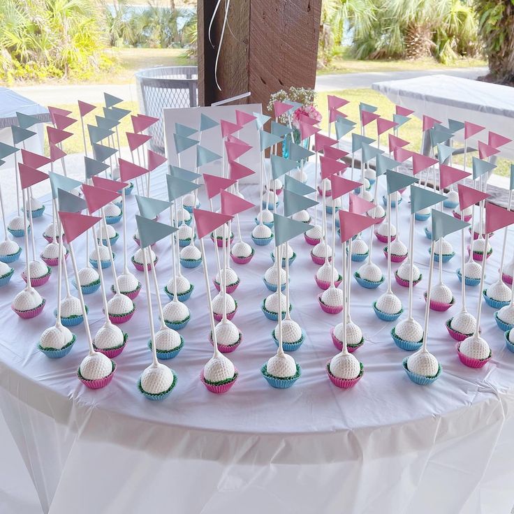 cupcakes and flags on a table at a party