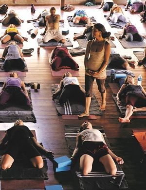 a group of people doing yoga on mats