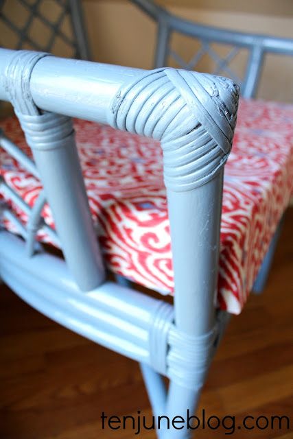 a blue chair with a red and white tablecloth on it's seat cushion