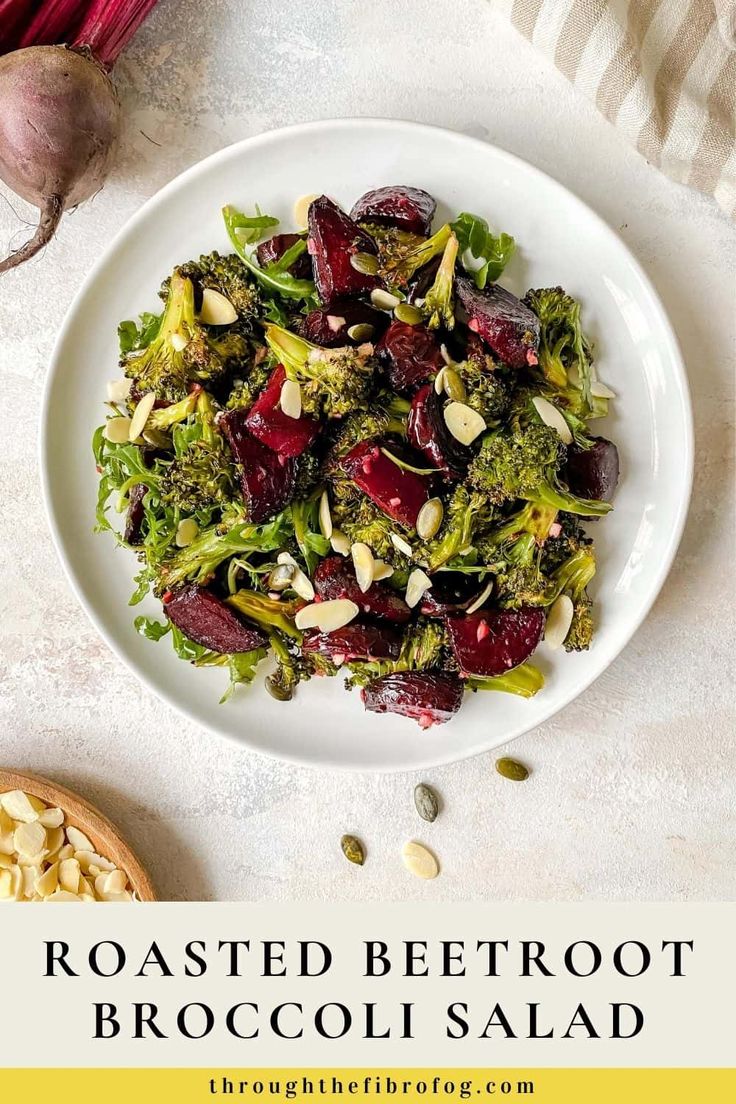 roasted beetroot and broccoli salad on a white plate with almonds